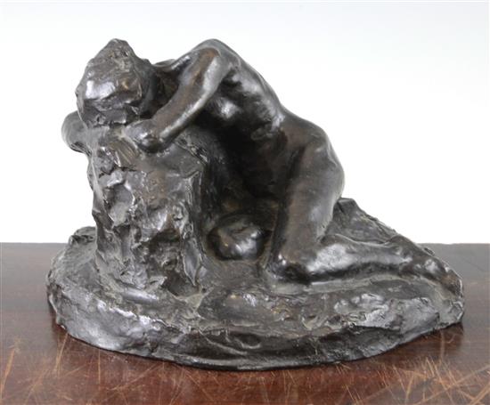 John Tweed (British, 1869-1933). A patinated bronze model of a recumbent female nude, 9.5in.